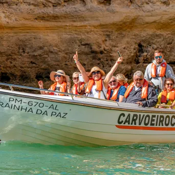 a group of people riding on the back of a boat