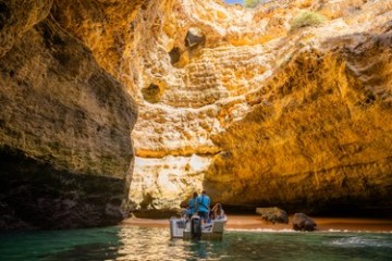 a body of water with a mountain in the background
