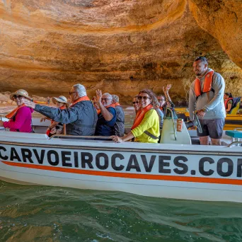 a group of people riding on the back of a boat