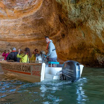 a group of people on a boat in the water