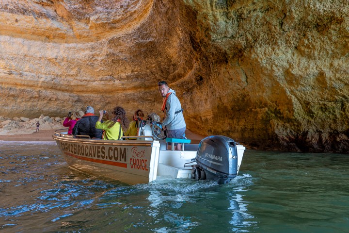a group of people on a boat in the water